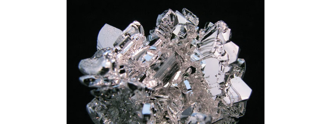 Magnesium supplements including BodyHealth Body Calm and Magnesium Breakthrough beside magnesium-rich foods