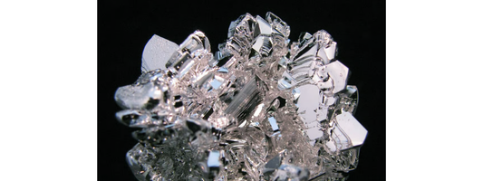 Magnesium supplements including BodyHealth Body Calm and Magnesium Breakthrough beside magnesium-rich foods
